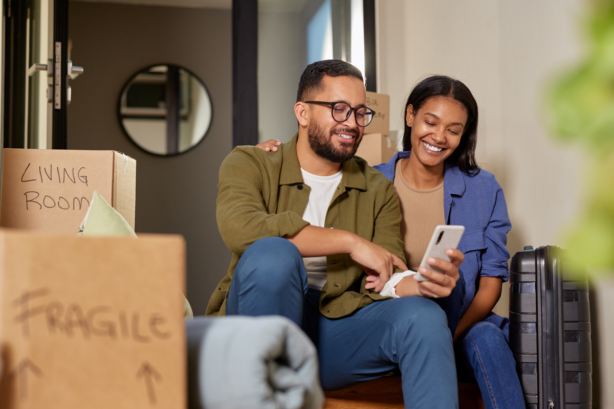 two young homeowners unpacking