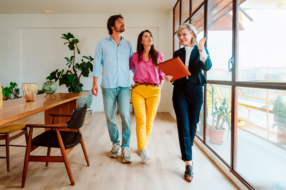 Real estate agent showing couple a home