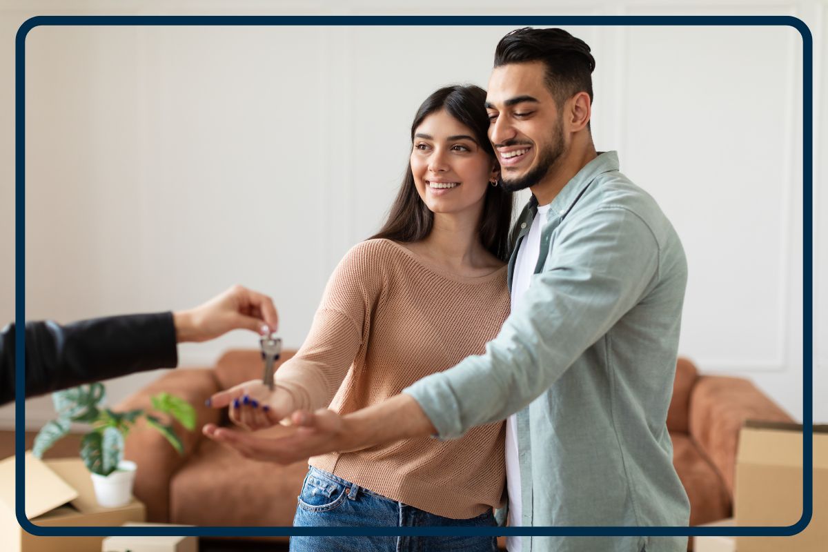 young couple receiving house keys